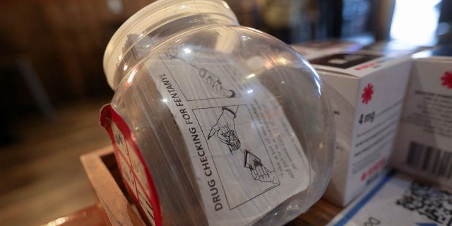 Fentanyl test strips are seen in a container at The Legionnaire bar in Oakland, California, on March 3, 2022.