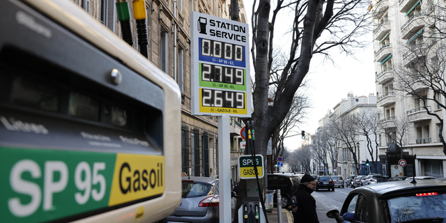A car stops at a gas station where prices can reach $3.04 a liter in Marseille, southern France, on March 9.