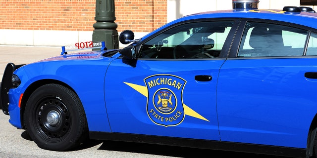 A Michigan State Police vehicle sits parked outside Comerica Park in Detroit, Michigan on September 27, 2019.