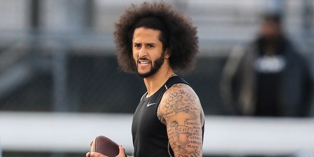 Colin Kaepernick looks to make a pass during a private NFL workout held at Charles R Drew high school on November 16, 2019, in Riverdale, Georgia. Due to disagreements between Kaepernick and the NFL the location of the workout was abruptly changed.  