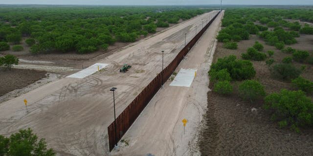 A photo taken on March 30, 2021 shows a general view of an unfinished section of a border wall that former US president Donald Trump tried to build near the southern Texas border city of Roma. (Photo by Ed JONES / AFP) (Photo by ED JONES/AFP via Getty Images)