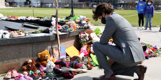 Canadian Prime Minister Justin Trudeau visits the makeshift memorial erected in honor of the 215 indigenous children remains found at a boarding school in British Columbia, on Parliament Hill, June 1, 2021 in Ottawa.