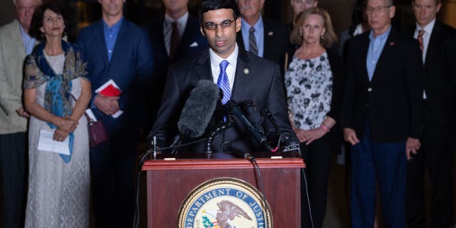 Acting US Attorney Raj Parekh (C), of the Eastern District of Virginia, speaks following the guilty pleas by Alexanda Kotey, a member of the notorious Islamic State kidnapping cell dubbed the "Beatles," to charges of conspiring to murder four American hostages, alongside the victims' families, outside the US District Court in Alexandria, Virginia, Sept. 2, 2021. 