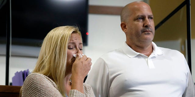 Tara Petito and Joe Petito react while City of North Port Chief of Police Todd Garrison speaks during a news conference about their missing daughter Gabby Petito Sept. 16, 2021, in North Port, Fla.
