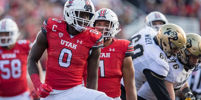 Devin Lloyd (0) of the Utah Utes celebrates sacking Brendon Lewis of the Colorado Buffaloes during a game Nov. 26, 2021, at Rice-Eccles Stadium in Salt Lake City, Utah.