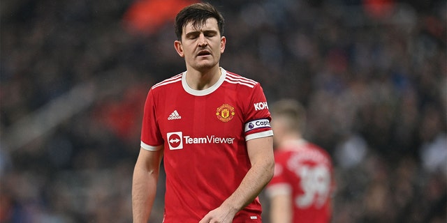 Manchester United's English defender Harry Maguire reacts after they concede the opening goal during the English Premier League football match between Newcastle United and Manchester United at St James' Park in Newcastle-upon-Tyne, north east England on December 27, 2021.