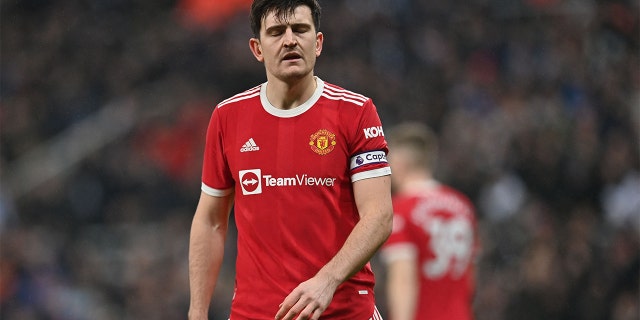 Manchester United's English defender Harry Maguire reacts after they concede the opening goal during the English Premier League football match between Newcastle United and Manchester United at St James' Park in Newcastle-upon-Tyne, north east England on December 27, 2021.