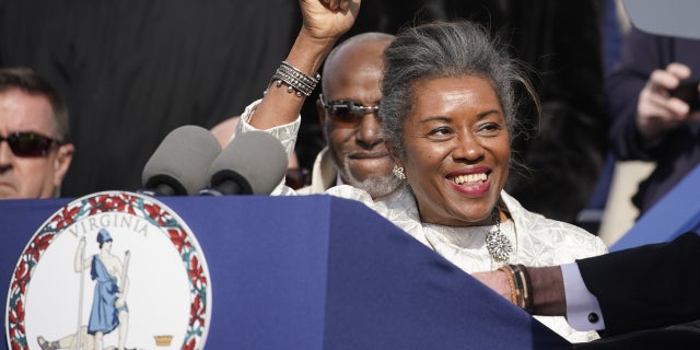 Winsome Earle-Sears, lieutenant governor of Virginia, gestures alongside husband Terence. Photographer: Al Drago/Bloomberg via Getty Images