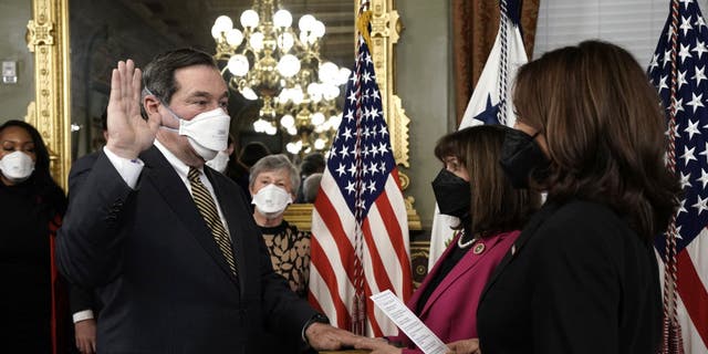 Vice President Kamala Harris swears in Joe Donnelly, ambassador extraordinary to the Holy See, in the Vice President's Ceremonial Office in Washington, D.C., on Feb. 24, 2022.