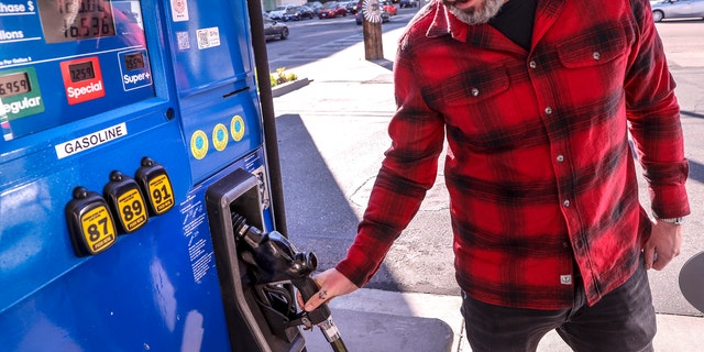 West Hollywood, CA, Tuesday, March 8, 2022 - Jesse Espersen from Topanga fills his SUV with 16.536 gallons of Super+ gas at 7.559 per gallon for 125 dollars at a Mobil station at the corner of La Cienega Blvd. and Beverly Blvd.(Robert Gauthier/Los Angeles Times via Getty Images)