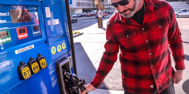 West Hollywood, CA, Tuesday, March 8, 2022 - Jesse Espersen from Topanga fills his SUV with 16.536 gallons of Super+ gas at 7.559 per gallon for 125 dollars at a Mobil station at the corner of La Cienega Blvd. and Beverly Blvd.(Robert Gauthier/Los Angeles Times via Getty Images)