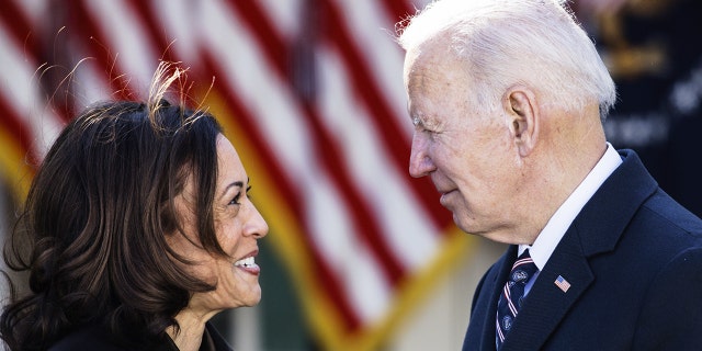 President Biden speaks with Vice President Kamala Harris after signing H.R. 55, the "Emmett Till Antilynching Act," during a ceremony in the Rose Garden of the White House March 29, 2022.