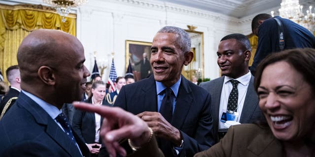 Former President Barack Obama and Vice President Kamala Harris depart following an event about the Affordable Care Act and lowering health care costs for families in the East Room of the White House in Washington, D.C., on April 5, 2022.