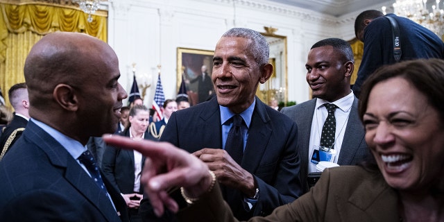 Former U.S. President Barack Obama, center, and U.S. Vice President Kamala Harris, right, depart following an event about the Affordable Care Act and lowering health care costs for families in the East Room of the White House in Washington, D.C., U.S., on Tuesday, April 5, 2022.