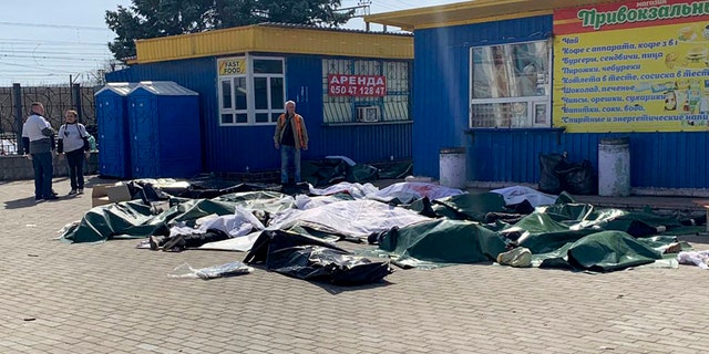 WARNING: GRAPHIC IMAGE: Casualties are laid out next to a platform after a bombing of the railway station in the eastern Ukrainian city of Kramatorsk on Friday.  