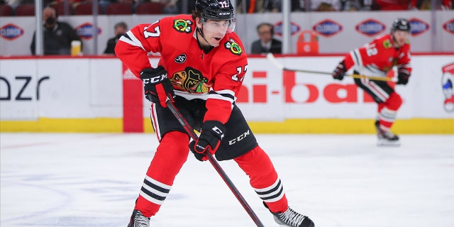 Blackhawks center Dylan Strome brings the puck up the ice against the Dallas Stars on April 10, 2022, at the United Center in Chicago.
