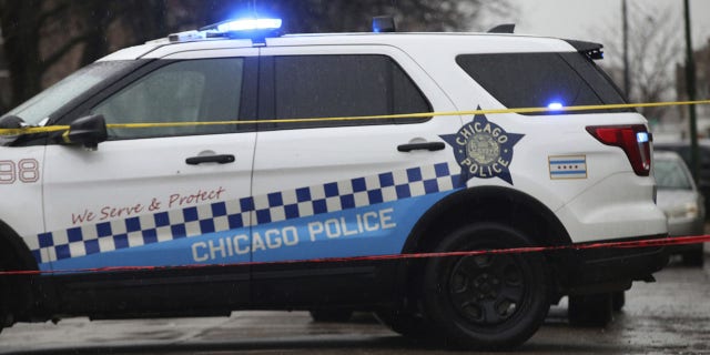 Bullet casings litter the street as police investigate the scene of a shooting on West Congress Parkway in Chicago, Feb. 22, 2022.