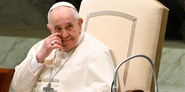 Pope Francis reacts during the weekly general audience on April 13, 2022 at Paul-VI hall in The Vatican. (Photo by Andreas SOLARO / AFP) (Photo by ANDREAS SOLARO/AFP via Getty Images)