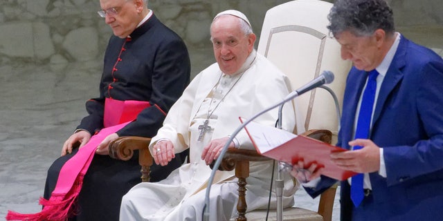 Pope Francis arrives on Wednesday, April 13, 2022 at Paul VI Hall in Vatican to attend a weekly general audience.  (Photo by Massimo Valiccia / Nur Photo via Getty Images)