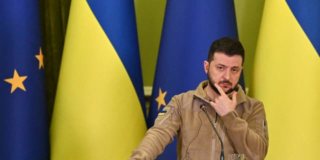 Ukraine's President Volodymyr Zelenskyy reacts during a press conference following his talks with President of the European Council in Kyiv on April 20, 2022. 