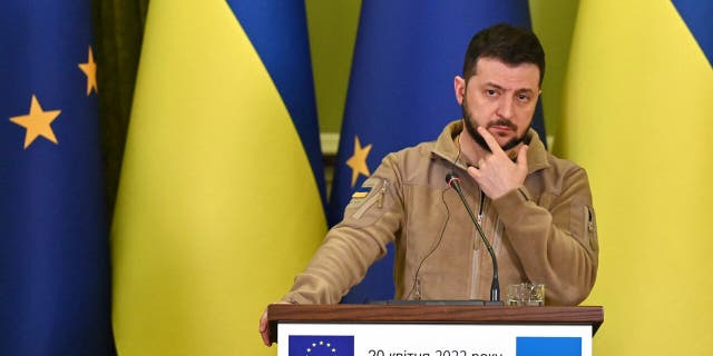 Ukraine's President Volodymyr Zelenskyy reacts during a press conference following his talks with President of the European Council in Kyiv on April 20, 2022.