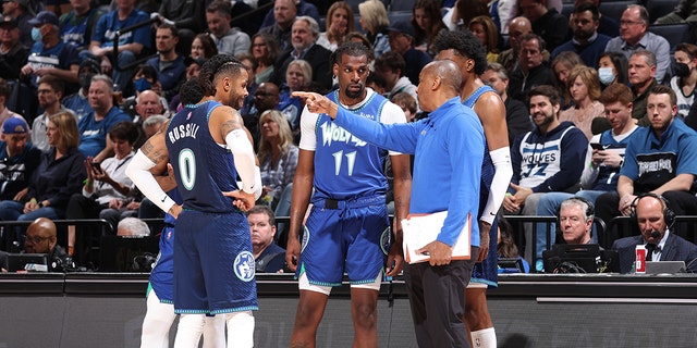 Assistant coach, Elston Turner huddles with the D'Angelo Russell #0, Malik Beasley #5, Naz Reid #11 and Jaden McDaniels #3 of the Minnesota Timberwolves during the third round of the 2022 NBA Playoffs on April 21, 2022 at Target Center of Minneapolis, Minnesota. 
