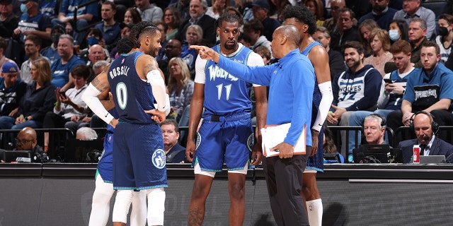 Assistant Coach, Elston Turner huddles with the D'Angelo Russell #0, Malik Beasley #5, Naz Reid #11 and Jaden McDaniels #3 of the Minnesota Timberwolves during Round 1 Game 3 of the 2022 NBA Playoffs on April 21, 2022 at Target Center in Minneapolis, Minnesota.