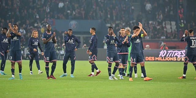 Players of Paris Saint-Germain greet fans after the French L1 soccer match between PSG and RC Lens at Parc des Princes stadium in Paris April 23, 2022.