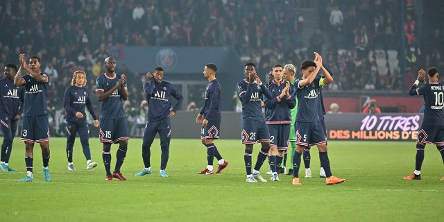 Players of Paris Saint-Germain greet fans after the French L1 soccer match between PSG and RC Lens at Parc des Princes stadium in Paris April 23, 2022.