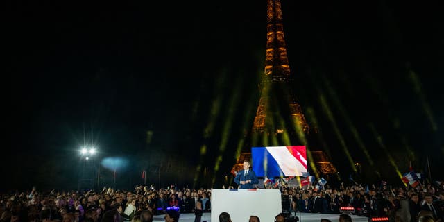 Emmanuel Macron, France's president, speaks to supporters following the second round of voting in the French presidential election in Paris, France, on Sunday, April 24, 2022.