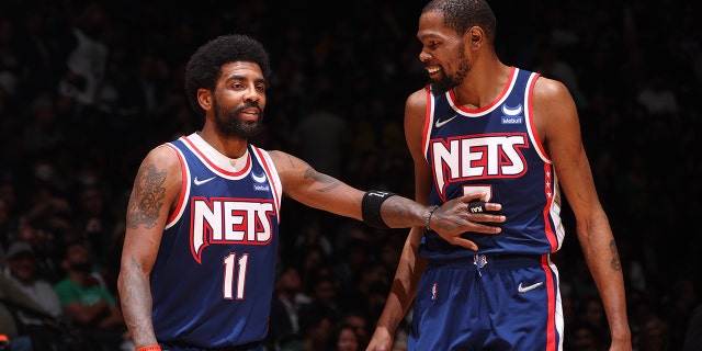 Kyrie Irving #11 talks to Kevin Durant #7 of the Brooklyn Nets during Round 1 Game 4 of the 2022 NBA Playoffs on April 25, 2022 at Barclays Center in Brooklyn, New York.