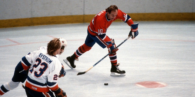 Guy Lafleur #10 of the Montreal Canadiens skates against the New York Islanders during an NHL Hockey game circa 1984 at the Nassau Veterans Memorial Coliseum in Uniondale, New York. Lafleur playing career went from 1971-85 and 1988-91. 