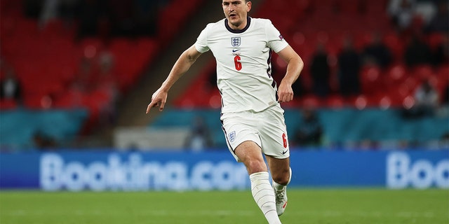 Harry Maguire of England runs with the ball during the UEFA Euro 2020 Championship Group D match between the Czech Republic and England at Wembley Stadium on June 22, 2021, in London, England. 
