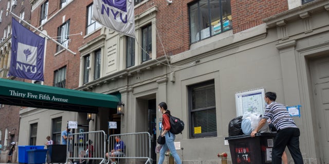 New York University (NYU) students walk by Rubin Hall in New York City.