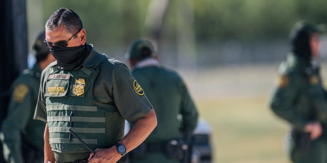 Border Patrol agents work a checkpoint at an entry near the Del Rio International Bridge.