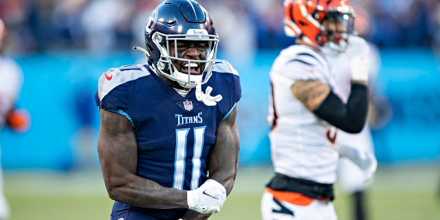 A.J. Brown #11 of the Tennessee Titans celebrates after a big catch during a game against the Cincinnati Bengals in the AFC Divisional Playoff game at Nissan Stadium on January 22, 2022, in Nashville, Tennessee. The Bengals defeated the Titans 19-16.