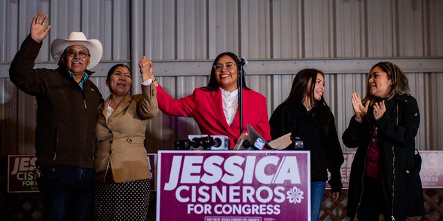 Democratic US congressional candidate Jessica Cisneros (TX-28) concludes a speech alongside her family during a watch rty on March 1, 2022 in Laredo, Texas.