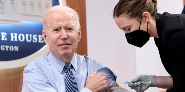 President Joe Biden receives a fourth dose of the Pfizer/BioNTech COVID-19 vaccine in the South Court Auditorium on March 30, 2022, in Washington, D.C. Before receiving his second booster shot, the president gave remarks calling on Congress to pass further legislation to provide more funding to aid the pandemic response. 