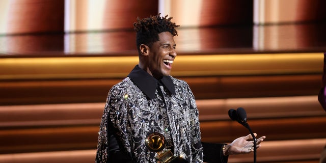 Jon Batiste accepts the Album of the Year award for "We Are" onstage during the 64th Annual Grammy Awards.