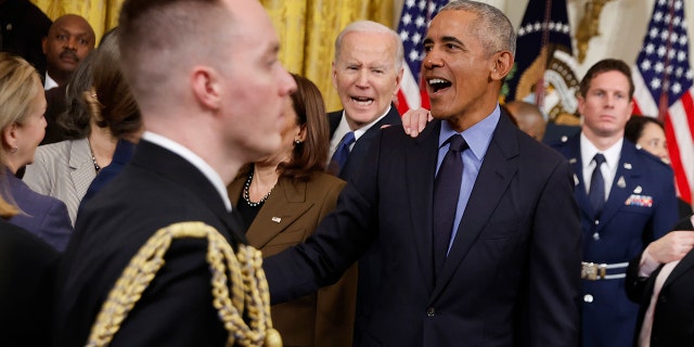 Former President Barack Obama and President Joe Biden greet friends and guests at the White House after marking the 2010 passage of the Affordable Care Act on April 5, 2022.