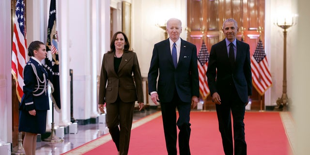 Vice President Kamala Harris, former President Barack Obama, and U.S. President Joe Biden arrive for an event to mark the 2010 passage of the Affordable Care Act in the East Room of the White House on April 5, 2022 in Washington, DC.