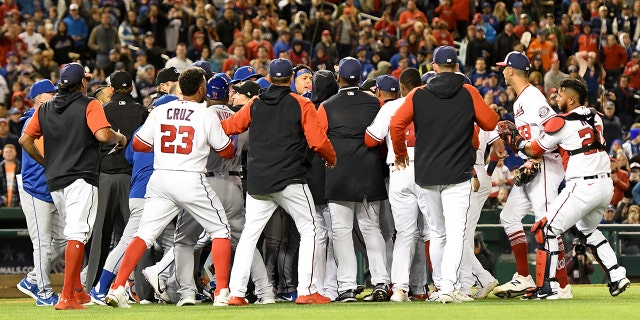 The benches clear after Steve Cishek #33 of the Washington Nationals hits Francisco Lindor #12 of the New York Mets with a pitch in the fifth inning during a baseball game at the Nationals Park on April 8, 2022, in Washington, DC.