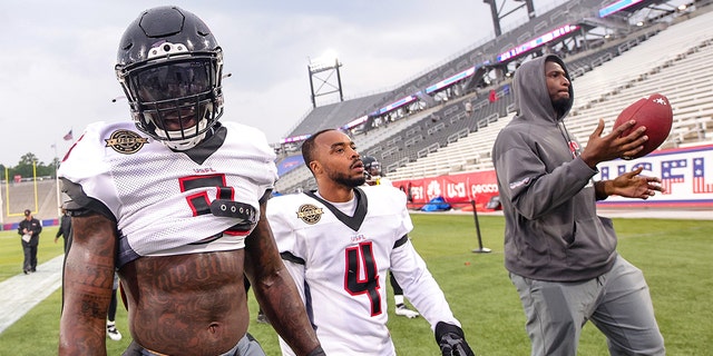 Reggie Northrup, left, and Will Likely of the Houston Gamblers walk off the field before the game against the Michigan Panthers at Protective Stadium on April 17, 2022 in Birmingham, Alabama. 