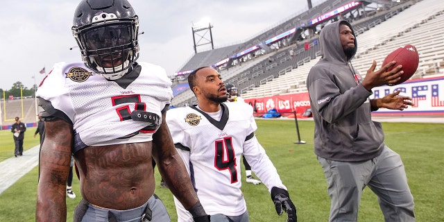 Reggie Northrup, left, and Will Likely of Houston Gamblers walk off the field before the game against the Michigan Panthers at Protective Stadium on April 17, 2022, in Birmingham, Alabama.