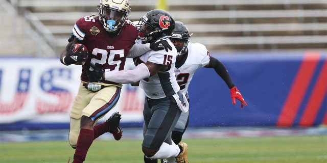 Stevie Scott III of Michigan Panthers rushes against Donald Payne of Houston Gamblers at Protective Stadium on April 17, 2022, in Birmingham, Alabama.