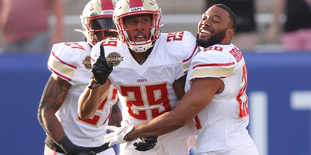Brian Allen #29 of Birmingham Stallions celebrates with teammates after getting an interception and running it for a touchdown in the first quarter of the game against the Houston Gamblers at Protective Stadium on April 23, 2022 in Birmingham, Alabama. 