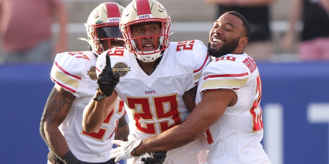 Brian Allen #29 of Birmingham Stallions celebrates with teammates after getting an interception and running it for a touchdown in the first quarter of the game against the Houston Gamblers at Protective Stadium on April 23, 2022 in Birmingham, Alabama.