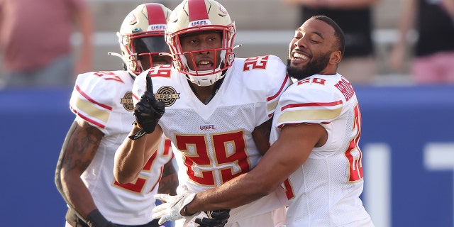 Brian Allen #29 of Birmingham Stallions celebrates with teammates after getting an interception and running it for a touchdown in the first quarter of the game against the Houston Gamblers at Protective Stadium on April 23, 2022 in Birmingham, Alabama. 