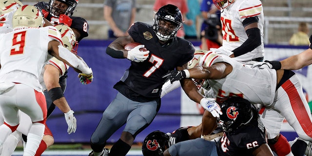 Mark Thompson #7 of Houston Gamblers runs with the ball in the fourth quarter of the game against the Birmingham Stallions at Protective Stadium on April 23, 2022 in Birmingham, Alabama. 