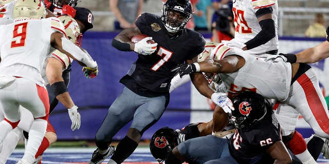 Mark Thompson #7 of Houston Gamblers runs with the ball in the fourth quarter of the game against the Birmingham Stallions at Protective Stadium on April 23, 2022 in Birmingham, Alabama.